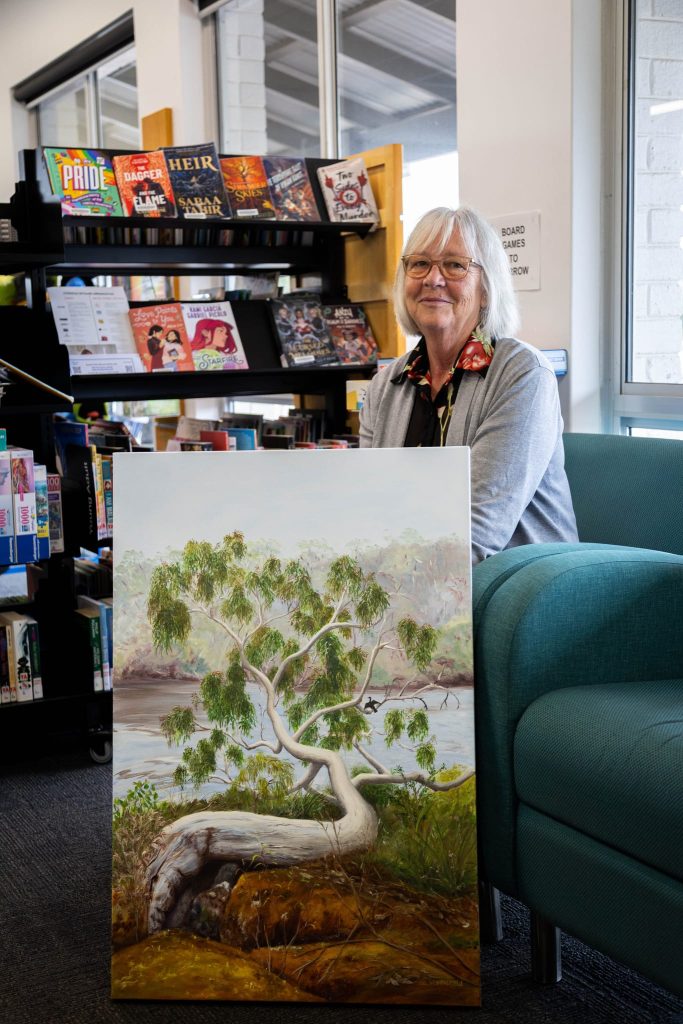 Wendy with painting of Scott River